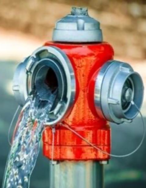 water flowing out of a red fire hydrant
